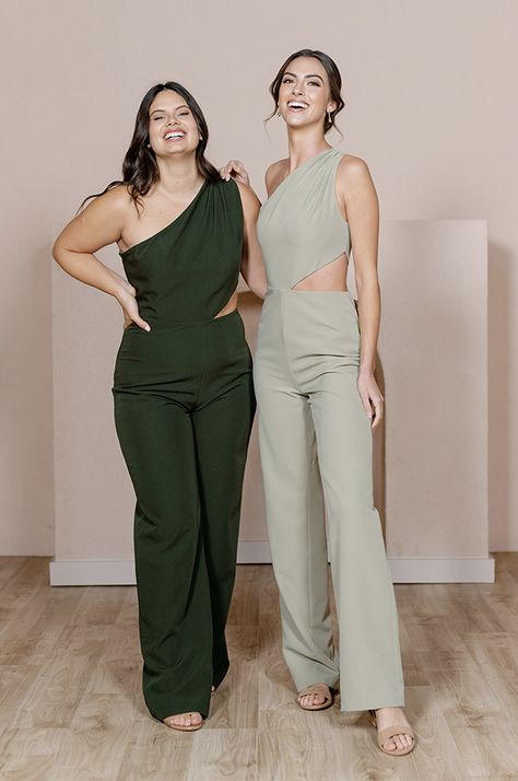 Our Lennon Jumpsuit is now available in all our crepe colors, making it the perfect option for the bridesmaid who desires a unique and edgy alternative to a dress! Lennon is modern and elevated in its design, featuring a one-shoulder draped bodice and a mid-size side cut-out that hits near the waist on the left side wi Sage Jumpsuit Wedding, Wedding Guest Outfit Gender Neutral, Queer Bridesmaid Outfit, Female Groomsman Attire, Bridesmaid Pantsuit Wedding, Bridesmaid Jumper, Fancy Jumpsuit Wedding, Officiant Outfit Female, Wedding Jumpsuit Guest