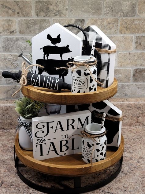 Cow Decor Farmhouse Style Living Room, Cricut Projects Farmhouse Decor, Sunflower And Cow Kitchen Ideas, Buffalo Plaid Tiered Tray Decor, Farm Tiered Tray, Cow Theme Kitchen Decor, Cow Print Kitchen Decor, Cow Tiered Tray Decor, Cow Farmhouse Decor