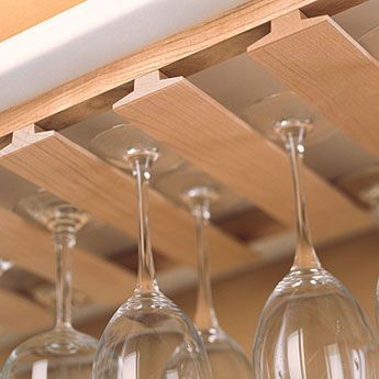 Watch this video to find out how to make an inexpensive rack to store and display wine glasses beneath the hanging cabinets in your kitchen, using standard T-molding available at home centers. Beam Kitchen, Hanging Rack, Rack Kitchen, Hanging Racks, Cabinet Lighting, Stemware, Kitchen Utensils, Home Cooking, Small Kitchen