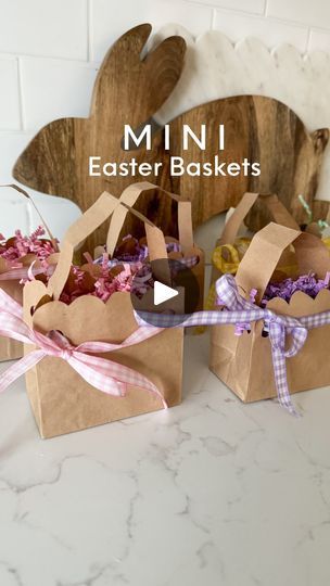 8.3K views · 958 reactions | Sprinkle joy across the table by MAKING festive yet simple mini DIY Easter basket place settings (with dessert treats inside)🐇✨

Created these specifically to match and coordinate with the scalloped runner and table scape decor from a few weeks back (tutorial of that one posted on my feed) Just pure joy! 🤸🏻‍♀️✨ 
.
What I used to MAKE these?!
.
Mini paper treat bags 
Hole punch
Ribbon x4 colors 
Scissors 
Glue stick 
Crinkle paper
Chocolate Easter eggs optional 
For my exact supplies comment “mini basket”✨
.
Save for when you go to MAKE🫶🏻
.
.
.

.
.
.
.
.
.
.
.
.
.
.
.
.
.
.
.
#eastertablesetting #eastertablescape #eastertableideas #diyeaster #diyeasterdecor #diygiftbags #minieasterbasket #easterbaskets #eastercraft #diyplacecards #eastercrafts #makeitwithm Back Tutorial, Diy Easter Basket, Paper Treat Bags, Mini Easter Basket, Chocolate Easter Eggs, Diy Place Cards, Dessert Treats, Easter 2024, Mini Basket