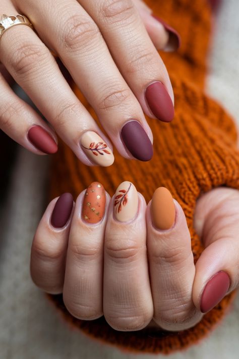 Embrace the beauty of autumn with these cozy round fall nail ideas! Picture rich burgundy and golden yellow swirls that capture the essence of falling leaves. This nail style not only brings warmth to your fingertips but also adds a stylish touch to your fall wardrobe. Perfect for any occasion, these nails are sure to turn heads and bring out the fall lover in you! Get ready for the season with these stunning designs. Fall Nails Ideas Autumn Almond Shape, Short Almond Nails Designs Simple, Fall Nail Designs Matte, Fall Vibes Nails, Fall Aesthetic Nails, Classy Fall Nail Designs, Cute Yellow Nails, Thanksgiving Nail Ideas, Seashell Nails