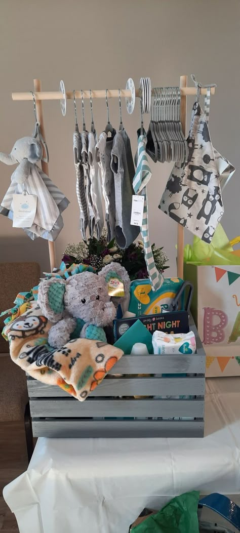 Baby Shower Gifts Boy Basket, Godbaby Gifts, Baby Basket Gift Ideas Boy, Baby Shower Basket Gift Ideas Boy, Boy Gift Basket Ideas, Baby Shower Hanging Clothes Gift Ideas, Baby Boy Gift Basket Ideas, Baby Shower Gift Ideas For Boys, Baby Boy Shower Gift Ideas