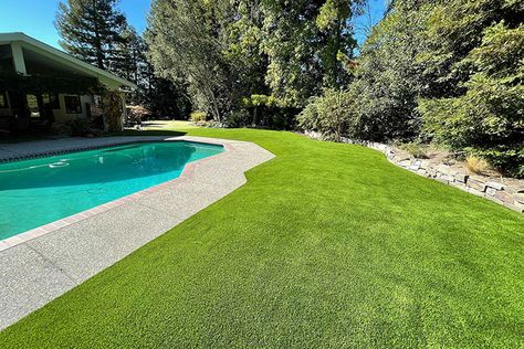 Why Artificial Turf Around the Pool Is Better than Real Grass Fake Turf Around Pool, Artificial Turf Around Pool Swimming, Turf Grass Around Pool, Pool Artificial Turf, Turf Pool Area, Concrete And Turf Pool Deck, Astroturf Around Pool, Astro Turf Around Pool, Pool With Grass Around It