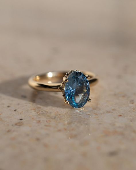 If you’re wondering what that gorgeous centre stone is, it’s a 2ct, oval blue spinel 💙 For even further flare, we have a stunning curved hidden moissanite halo Details: - 2ct oval blue spinel - 20x round moissanites - 10k yellow gold - 2.3mm wide shank #engagementringdesign #customengagementring #spinelengagementring #nz #ovalengagementring #aus #engagementringideas Spinel Engagement Rings, Boda Ideas, Happy Bride, Blue Engagement Ring, Blue Spinel, Classic Engagement, Blue Stone Ring, Classic Engagement Rings, Oval Rings