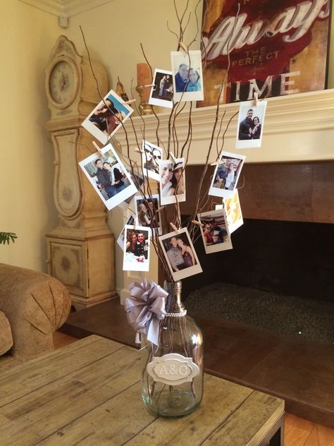 Pictures On Sticks Centerpiece, Picture Display On Table, Photo Display For Anniversary Party, Photograph Centerpieces, Family Reunion Table Decorations, Photo Centerpiece Ideas, Photo Table Decorations, Decoration With Photos, Photos Luminaries