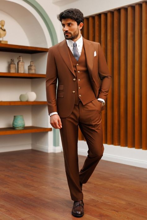 Indulge in the versatility of our Brown Slim-Fit Suit 3-Piece, perfectly suited for formal events and business settings, ensuring a smart and stylish appearance that never goes unnoticed. #slimfitsuit #mensfashion #suitup #dapperstyle #groomstyle #weddingattire #specialoccasion #formalwear #classiclook #suit #suits