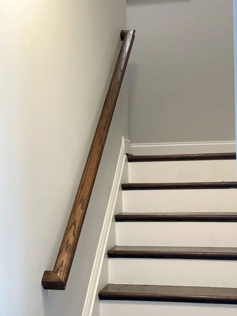 Basement railing stained using a dark stain to match the stairs. Paint Oak Stair Railing, Stain Stair Railing, Stain And Seal Wood, Basement Railing, How To Restain Wood, Wood Banister, Oak Banister, Redo Stairs, Wood Staining