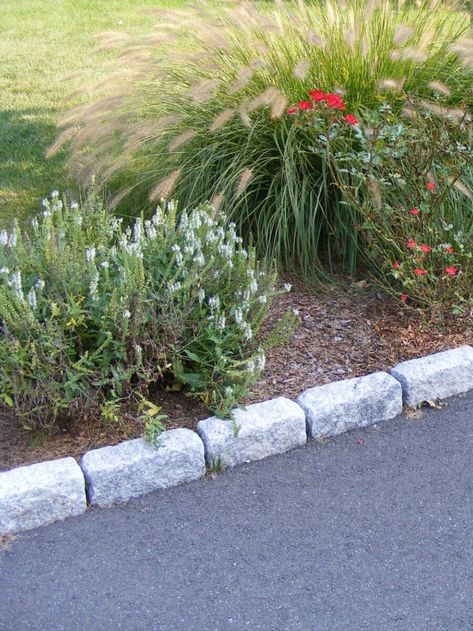 Standard granite cobblestones used as driveway edging. Granite cobblestones are an ideal paving material for driveways because of their long-lasting quality and textured finish, which provides traction on steep surfaces. Driveway Edging, Edging Stones, Cobblestone Driveway, Stone Edging, Privacy Landscaping, Driveway Landscaping, Lawn Edging, Backyard Paradise, Fence Landscaping