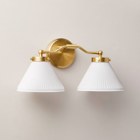 Illuminate your bedroom, living room or hallway in luxurious style with this Reeded Milk Glass 2-Bulb Vanity Wall Sconce from Hearth & Hand™ with Magnolia. Designed with two white reeded milk glass cone shades and a gold-tone metal fixture, this vanity wall sconce requires two E26 bulbs and features a one-way light setting. The sconce has no switch and requires hardwired installation (tools not provided), and it comes with the required mounting hardware to save you a bit of time. Hearth & Hand™ Lighting Over Bathroom Mirror, French Vanity Light, Over Mirror Lighting Bathroom, Two Light Vanity Fixture, Powder Room Lighting Above Mirror, Bathroom Vanity Lighting Black, Powder Bath Lighting, Wall Sconces Hallway, Black Hardware Bathroom