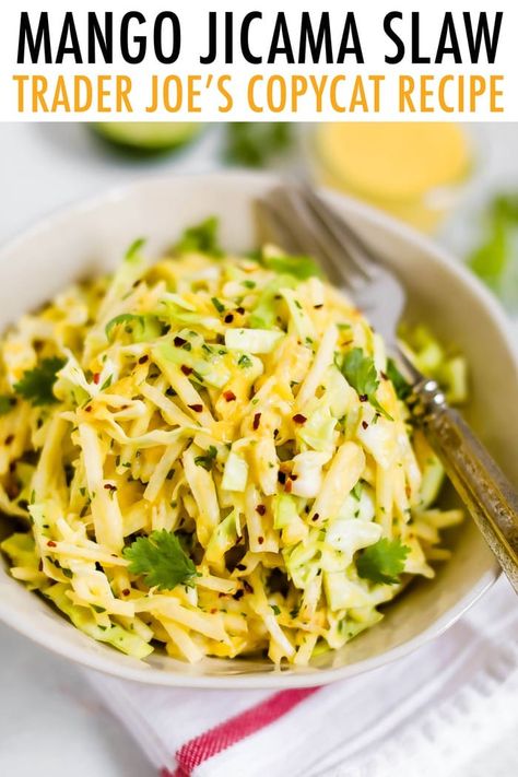 This mango jicama slaw with a spicy and sweet mango dressing is a copycat recipe for the Trader Joe's slaw. It's light, refreshing and makes a perfect summer side or topping for tacos. #jicamaslaw #jicamarecipe #traderjoescopycat #copycatrecipe #eatingbirdfood Jicama Recipe, Mango Dressing, Jicama Slaw, Mango Slaw, Eating Bird Food, Cole Slaw, Vegetarian Cabbage, Slaw Recipes, Mango Recipes