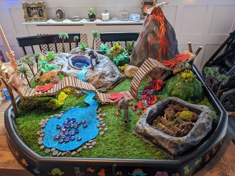 Dinosaur garden, paper mache, volcano, fossil pit, made from household waste Diy Dinosaur Play House, Dinosaur Park Diy, Small World Dinosaur Play, Dinosaur Table Play, Diy Dinosaur Play Area, Diy Dinosaur Toy, Dinosaur Garden Ideas, Dinosaur House Diy, Diy Dinosaur Play Table