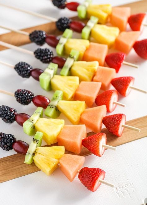 Colorful fruit kabobs are the best appetizer or side for any occasion! Load up your favorite fruits and get snacking. Rainbow Fruit Kabobs, Dessert Kabobs, Yogurt Fruit Dip, Luau Party Food, Rainbow Snacks, Luau Food, Fruit Kebabs, Fruit Appetizers, Cut Strawberries