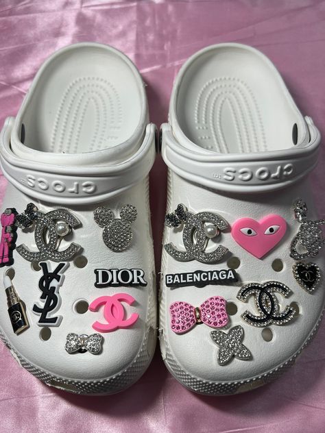 Luxury Croc Charms, White Blinged Out Crocs, Baddie Croc Charms, White Croc Charm Ideas, Crocks With Charms, Designer Crocs Charms, Croc Inspo Charms, Cute Crocs Shoes Charms, White Crocs Charms