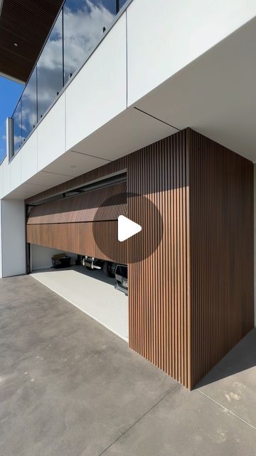 TOWER GARAGE DOORS AUSTRALIA on Instagram: "Discover elegance!   in simplicity with our flush mount door, expertly clad in @newtechwoodaustralia cladding. It’s not just a door—it’s the gateway to a home that speaks volumes about style and sophistication." External Garage, Concealed Garage Door, Modern Garage Ideas, Garage Door Modern, Garage Doors Modern, Garage Cladding, Modern Wood Garage Door, Garage Doors With Open Slats For Airflow, Garage Doors With Open Slats Residential