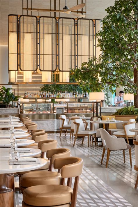 The 7.3m-high ceiling affords a panoramic view of the ocean while fans suspended from the high ceiling take inspiration from the verandas of the famous Repulse Bay Hotel. Bespoke screens, woven finishes, and abaca sheer blinds were commissioned for the space, inspired by the overarching nautical influence. Photography by Owen Raggett. #ArchitectureAndDesign #HospitalityDesign #ResortDesign #LuxuryResort #LuxuryHospitality#FullertonOceanPark #HongKong #FullertonStories #FullertonHotels Restaurant Interior Design Modern, Luxury Hotel Lobby, Boho Restaurant, Hotel Restaurant Design, Luxury Hotels Lobby, Restaurant Design Inspiration, Modern Restaurant Design, Luxury Restaurant, Hotel Interior Design