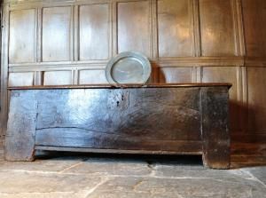 CHESTS / COFFERS - THE SINGLE BOARD WALNUT TOP WITH HEAVY IRON HINGES, ABOVE A FRONT OF A SINGLE PLANK WITH LARGE IRON LOCKPLATE. THE CONSTRUCTION CONSISTS OF FOUR WIDE STILES CARRIED DOWN TO THE FLOOR AS LEGS INTO WHICH LARGE BOARDS ARE TENENED AND PEGGED TO FORM THE Medieval Chest, English Antique Furniture, Iron Hinges, Medieval Furniture, English Walnut, Antique Chest, Medieval Style, English Antiques, Country Furniture