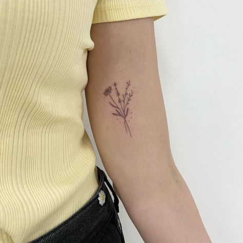 Fine line flower bouquet tattoo on the inner arm Inner Arm Line Tattoos For Women, Arm Bouquet Tattoo, Fine Line Tattoo Bicep, Flowers Inner Arm Tattoo, Flower Tattoo On Inner Arm, Inside Of Upper Arm Tattoo Women, Bicep Bouquet Tattoo, Inner Arm Tattoo Flower, Flower Bouquet Tattoo Bicep