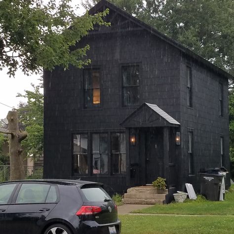 Painted black cedar shake house Black Cedar Shake House, Black Shingle House, Black Shingle Siding, Cedar Shingles Black Windows, Black Cedar Shake Siding, Dark Cedar Shake House, Shaker House Exterior, Dark Blue Shingle House, Black Cedar House