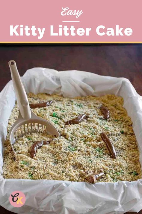 Overhead view of a rectangular baking dish with parchment paper under a baked cake with a kitty litter scoop in it. Tootsie roll candies on top. Kitty Liter Cake, Litter Box Cake, Epic Halloween Party, Kitty Litter Cake, Box Cake Recipes, Tootsie Rolls, German Chocolate Cake Mix, Litter Scoop, Kitty Litter