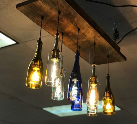 Bottle Lights Ideas, Wine Bottle Chandelier, Bottle Chandelier, Bar Counter Design, Cluster Chandelier, Recycled Wine Bottle, Counter Design, Lighted Wine Bottles, Metal Chandelier