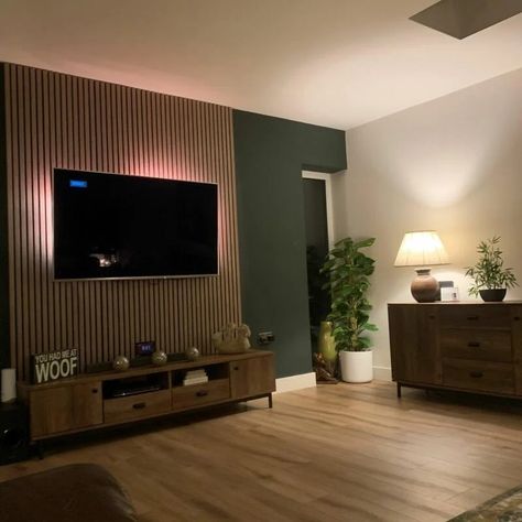 Moody Paneling, Wood Panels Living Room Wall, Green Tv Feature Wall, Slat Feature Wall Living Room, Wood Panelling Walls Living Room Tv, Slat Wall Living Room Tv, Panelled Walls Small Living Room, Lounge Wood Panelling, Slat Panel Wall Living Room