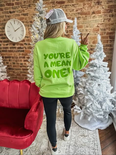 You’re a Mean One Puff Sweatshirt Comes in lime green or hot pink Sizes: S-3XL TAT: 2-3 business days Diy Vinyl Christmas Shirts, Christmas Vinyl Sweatshirts, Holiday Tshirt Designs, Vinyl Sweatshirt Ideas Cricut, Grinch Sweatshirt Ideas, Puff Vinyl Shirts, Puff Vinyl Sweatshirt, Bartending Shirts, Vinyl Sweatshirt Ideas