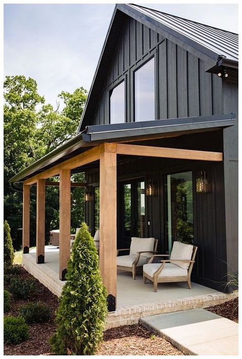 Front House Entry Ideas, Raised Beds Front Of House, Peaked Ceiling Living Room Wood Beams, She’d Roof Cabin, Modern Farmhouse Ranch Exterior Ideas, Barndo With Screen Porch, Black Steel Siding, The Barndominium Lady, Modern Cabin Mudroom