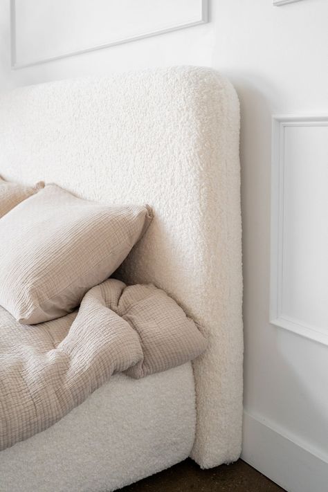 A close up of a white boucle headboard. Teddy Bear Storage, Boucle Headboard, Bear Storage, White Minimal, Walnut Dining Table, Bedroom Headboard, Master Bedding, New Journey, Storage Bed