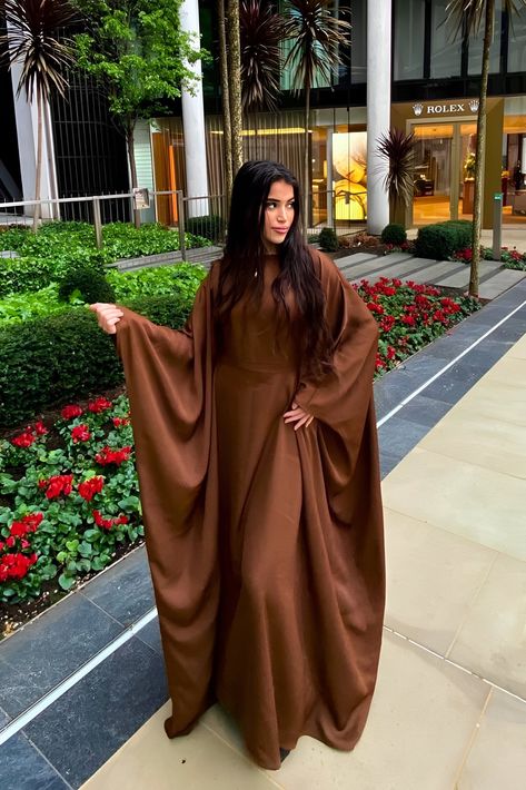 This Premium Chocolate Butterfly Abaya makes elegance and simplicity look easy! Crafted from luxurious fabric and precision-stitched, you'll feel as comfortable as you look stunning. Every detail of this classic silhouette has been carefully considered, while its inner lining adds a timeless touch. Transform your wardrobe with this effortlessly beautiful piece!- Premium High Quality Nidha- Discreet Inner Belt (Optional)- 100% Polyester (light weight and soft)- Model is 5'7 and wears a size 58- M Chocolate Butterfly, Elegant Abayas, Butterfly Abaya, Chocolate Butterflies, Modesty Outfits, Premium Chocolate, Hijabi Style, Muslimah Aesthetic, Abaya Designs