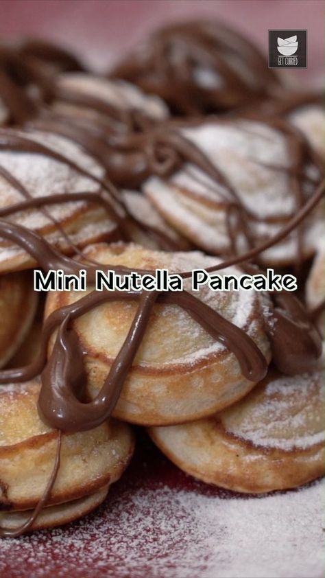 Looking for a sinful delight to sink your teeth into? If yes, then this Nutella Pancake is perfect for you! Made by stuffing nutella into the pancake and then garnished with some more nutella and icing sugar, it is a absolute treat to your taste buds. Do give it a try and share your feedback in the comments below. Ingredients: 3/4 cup Milk 1 tbsp Apple Cider Vinegar 1 cup All-Purpose Flour Salt 1/4 tsp Baking powder 1/8 tsp Baking soda 1 tbsp Caster Sugar 1 Egg 1 tsp Vanilla Extract 1 tbsp Oil Nutella Pancakes, Mini Nutella, Icing Sugar, Caster Sugar, 1 Egg, Cider Vinegar, Caster, Apple Cider Vinegar, Taste Buds