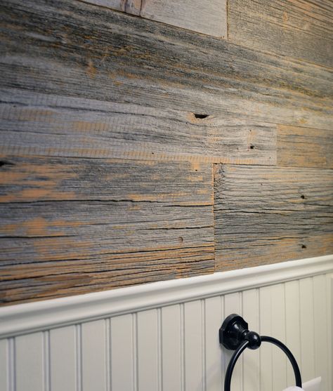 With just the right amount of color and texture reclaimed grey barn wood contrasts the bead board in this stylish bathroom. | #greybarnwood  #greywalls #barnwood #reclaimedwoodpaneling #woodwall #reclaimedwood #accentwall #greypaneling #rusticwoodwall Wood Walls In Bathroom, Update Paneling Walls Ideas, Shiplap Wall Bathroom, Rustic Wood Paneling, Bathroom Wood Wall, Dirt Driveway, Paneling For Walls, Reclaimed Wood Wall Panels, Reclaimed Wood Paneling