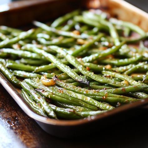 Roasted green beans are a delicious and nutritious side dish that’s quick to prepare and pairs beautifully with almost any main course. This recipe enhances the natural flavor of green beans with a light seasoning and a quick roast in the oven for a perfect balance of tenderness and crisp edges.     Equipment: Baking sheet Parchment paper or aluminum foil Mixing bowl Tongs or spatula Ingredients: 1 pound fresh green beans, trimmed 2 tablespoons olive oil 1 teaspoon garlic powder ½ teaspoon ... Best Oven Roasted Green Beans, Roasting Green Beans In Oven, Baking Green Beans Oven, Green Bean Oven Recipe, Bake Green Beans Oven, Green Beans Seasoning, Fresh Green Bean Recipes Baked, How To Prepare Green Beans, Best Way To Cook Fresh Green Beans