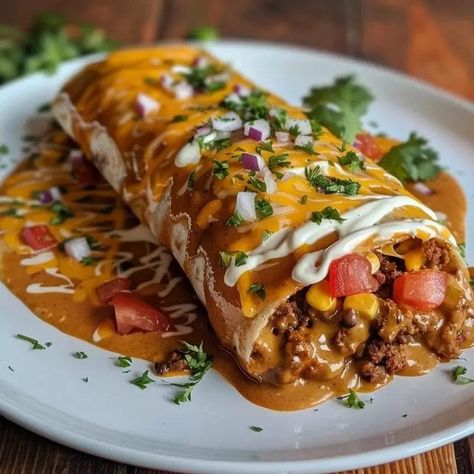 Wet burritos are a beloved comfort food, known for their hearty fillings, rich sauces, and cheesy toppings. They bring together the best elements of traditional Mexican cuisine in a single, indulgent dish. The name “wet” comes from the generous amount of sauce that smothers the … El Monterey Burritos Recipes, Beef Wet Burrito Recipe, Wet Burrito Recipe Ground Beef, Brisket Burritos, Wet Burrito Recipe, Wet Burrito Recipes, Beef And Bean Burritos, Wet Burrito, Chile Peppers