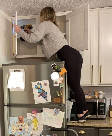 You know those cabinets over your fridge? You know, the ones you can't reach so you just store random stuff in there and forget about it. Or you just keep them empty. Yeah, you know the ones. These: There has been absolutely nothing in these cabinets since we bought this house 2 years ago. SOOOO- Let's take it down, shall we? Step 1: Remove cabinet doors Go ahead and take those useless doors off. We wont be needing them. Step 2: Remove screws Remove all screws that are attaching th… Removing Cabinets From Wall, Doors Off Kitchen Cabinets, Over Fridge Ideas, Open Shelf Above Fridge, Removing Kitchen Cabinet Doors, Shelves Above Fridge, Cabinets Above Refrigerator, Cabinet Above Refrigerator, Cabinet Over Fridge