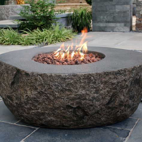 These fire pits are cut from real stone and add a modern rustic feel. Outside Fire Pits, Fire Pit Materials, Natural Gas Fire Pit, Outdoor Fire Pit Table, Propane Fire Pit Table, Concrete Fire Pits, Gas Fire Pit Table, Wood Burning Fire Pit, Propane Fire Pit