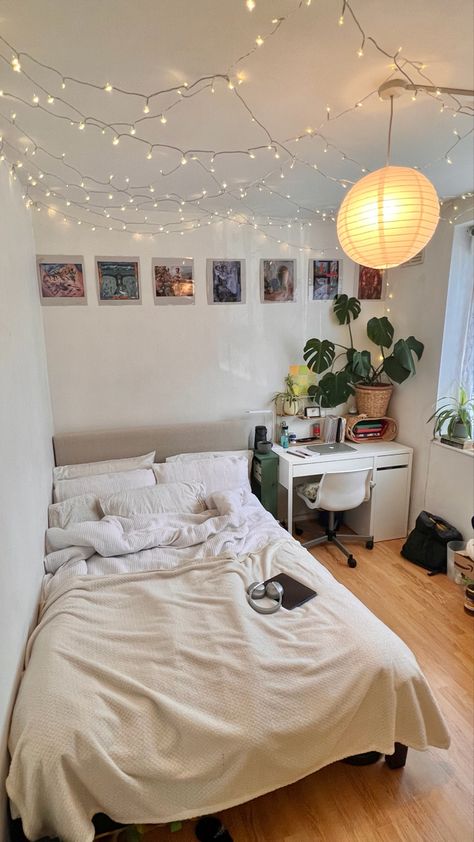 my little cosy uni house bedroom - decorated with plante, cushions, blankets, a paper lampshade, fairylights & love🫶🏽🫶🏽🫶🏽🫶🏽 #room #roomdecor #decor #roomideas #bedroominspo #inspo #neutraldecor Off White Bedding, Wall Art Plants, Uni House, Uni Bedroom, Plants Poster, Plants Wall Art, Dorm Room Wall Art, Art Plants, Bedroom Decor For Small Rooms