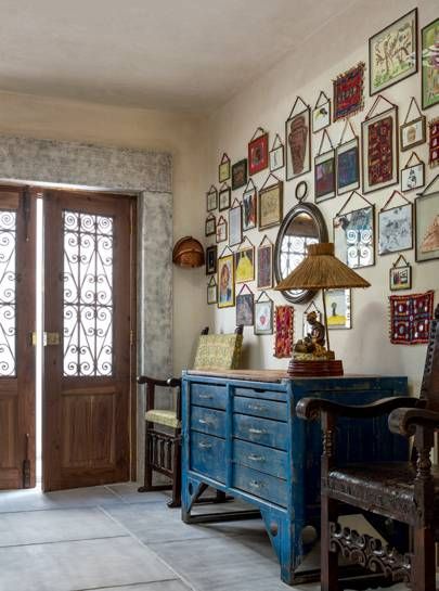 In the hall, artwork by Rebecca’s children hangs above a Forties Czech workbench. Greece House, Bamboo Roof, Petersham Nurseries, Greek Decor, Australian Interior, Australian Interior Design, Lighting Plan, House By The Sea, Island House