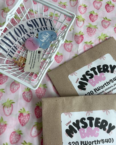 a shrouded mystery❓🎀 THIS NEW IN: mystery bags will be up for grabs at our upcoming NAO pop-up! they consist of up to $40 worth of stickers, pins, keychains, prints and more 💘 we’ll also be including some discontinued items as well as unreleased stickers, just for half the price 🤩 swing by if you’re around the area! ☁️ what else would you like to see inside? #taylorswift #taylorsversion #taylornation #thetorturedpoetsdepartment #ttpd #mysterybag #theerastour #tstheerastour Stationery, Mystery Bags, Market Displays, Mystery Bag, Popular Culture, Keychains, Instagram A, 1st Birthday, Pop Up