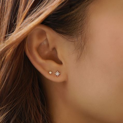 Adorable and versatile tiny Starburst studs crafted with a cubic zirconia crystal center. Add this celestial darling to your ear stack! .925 Sterling Silver Cubic Zirconia crystal Hypoallergenic post Diameter: 5.6mm Stone center: 1.5mm #E494 2nd Ear Piercing, Double Lobe Piercing, Minimalist Ear Piercings, Second Ear Piercing, Ear Piercing Studs, Double Ear Piercings, Trendy Stud Earrings, Pretty Ear Piercings, Double Earrings