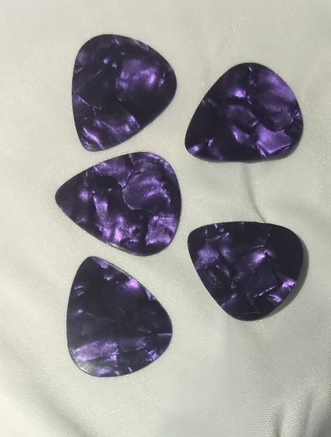 Guitar Players....picks, picks and more picks....!  Hand punched, these Purple Metallic Guitar Picks have a smooth finish and are light gauge, .48mm....  Sold 5 per pack....