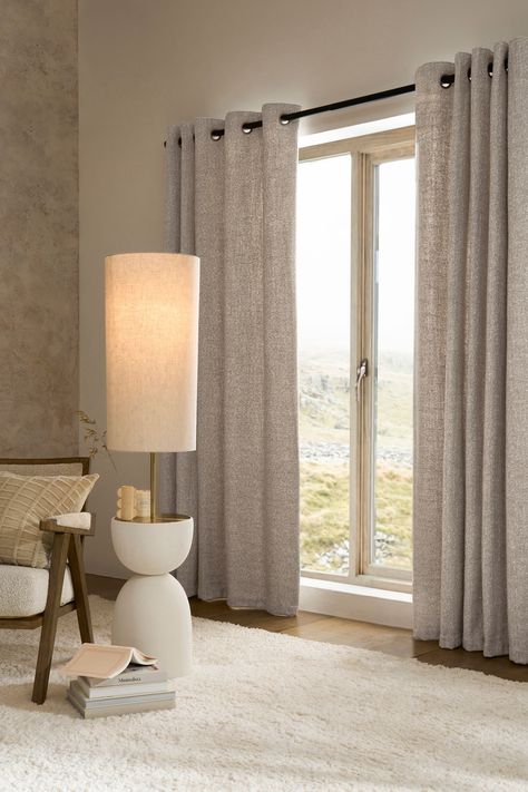 In a textured cosy fabric, these curtains are the perfect addition to any room in your house. The heavyweight fabric drapes beautifully and feels tactile and cosy. Simple silver brushed eyelets make them easy to pair with your existing or chosen curtain pole. The standard lightweight lining adds an extra layer to the back of curtains to provide added durability and to help prevent fading over time. Or, beat the chill and keep your home warm and cosy with our super thermal lining. For top tips on Beige Curtains Living Room, Lounge Curtains, Lounge Room Styling, Interior Design Curtains, Curtains Living Room Modern, Neutral Curtains, Cream Living Rooms, Window Curtains Living Room, Beige Curtains