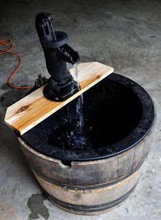 Make a (Whiskey Barrel) Fountain Whiskey Barrel Fountain, Barrel Pond, Old Water Pumps, Barrel Fountain, Hand Water Pump, Farmhouse Makeover, Diy Water Feature, Patio Pond, Diy Water Fountain