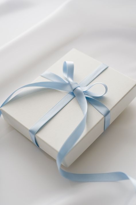 A blue satin bow wrapped around a white box is the chicest way to wrap a gift for any occasion. Baby Blue Aesthetic, Light Blue Aesthetic, Good Color Combinations, Bleu Pastel, Blue Gift, Aesthetic Colors, White Box, White Gift Boxes, Blue Christmas