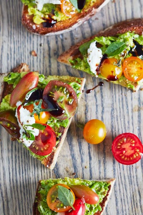 When it comes to avocado toast, the best slices go well beyond two ingredients. If you require further proof, let us present this caprese avocado toast. All the components of a caprese salad — from the ripe tomatoes and the creamy mozzarella to the fresh basil and the tangy balsamic glaze — are a good friend to the cool avocado. If there was ever an example of when the whole is better than the sum of its parts (and we're talking about irresistible parts!), caprese avocado toast nails it on th... Caprese Avocado Toast, Caprese Avocado, Avocado Toast Recipes, Breakfast Fruit Salad, Avocado Recipes Easy, Mediterranean Diet Breakfast, Mediterranean Breakfast, Mediterranean Diet Recipes Dinners, Mediterranean Diet Meal Plan