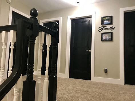 This is our upstairs hallway! Revere Pewter paint color and black doors with chunky white trim!!!! Love love this combo Black Doors Upstairs, Black Door Hallway, Black Doors White Trim, Black Doors With White Trim, Pewter Paint Color, Revere Pewter Paint, Hallway Upstairs, Trim Windows, Hallway Paint Colors