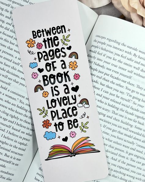 Between the Pages of a Book Bookmark! ⋆ Sizing: 2.5 x 7 inches ⋆ Printed on One Side | Plain Backing with Logo ⋆ Rounded edges ⋆ Laminate Finish ⋆ Bookmark for reading, journals, agendas ⋆ Use of 69lb Paper 💌DM to Order or Purchase on My Etsy Shop (link in bio) Book Lover Bio Ideas, Cute Aesthetic Journal Ideas, Bookmark Ideas With Quotes, Simple Bookmark Ideas, Book Mark Aesthetic, Bookmark Sayings, Cute Bookmarks Diy, Bookmarks Handmade Aesthetic, Cute Bookmarks Handmade