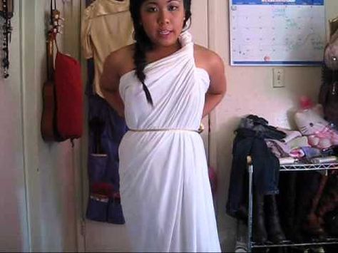 don't want to go out and buy a costume for halloween? go ahead and use an old bedsheet or fabric big enough to wrap around yourself. quick, fast, easy, and cute! hope you enjoy :)    greek goddess tutorial with sewing: http://www.youtube.com/watch?v=mwH_IIrG50s    greek goddess hair tutorial: http://www.youtube.com/watch?v=nB4zrUd-SnA    blog:  http://... Diy Toga Costume For Women, How To Tie A Toga, Toga Fancy Dress, Toga Costume Diy, Toga Party Costume, Diy Toga, Greek Goddess Costume Diy, Goddess Costume Diy, Greece Costume