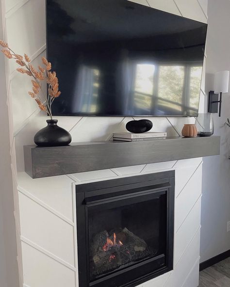 Fireplace Decor With Tv Modern, Dark Gray Mantle, Mantel Decorating Ideas Under Tv, Minimal Mantle Decor With Tv, Chimney Decor With Tv, Decorating A Fireplace Mantle With A Tv, Mantel Under Tv Decor, Modern Mantle Ideas, Under Tv Mantle Decor