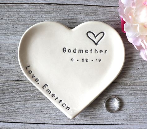 "This large heart dish makes a sweet Godmother gift or gift from godchild. You can give this to her at the baptism, Christmas, birthday or any occasion in-between. This attractive ring dish features the word \"Godmother\" and a heart.   You can personalize this item with your special name and a date. These handmade, hand-glazed dishes make unique gifts for a baptism or birthday.  Your loved ones will enjoy this quality handmade gift for years to come. Our large sized heart dish can accommodate m Baptism Ideas Girl, Baptism Gifts For Baby Girl, Baptism For Girl, Christening Ideas Girl, Baby Baptism Party, Godparent Request Ideas, Godmother Gifts Baptisms, Baptism Baby Girl, Baptism Birthday Party