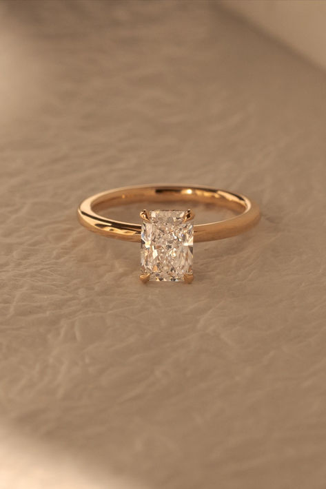 Dazzling in simplicity, this radiant solitaire engagement ring steals the spotlight with its hidden halo, adding the perfect touch of magic to the promise of forever 💍⁠ ⁠Ring Details:⁠ Liberty Radiant Solitaire⁠ Lab Grown Diamond⁠ 1.91ct | F | VS2⁠ 18k Rose Gold engagement ring ideas engagement rings simple engagement ring set engagement ring designs lab diamond engagement ring solitaire engagement ring rose gold rings rose gold ring engagement Wedding Rings Simple Gold Band, Thing Gold Band Engagement Ring, Unique Engagement Ring With Band, Simple Engagement Rings 2 Ct, Simple Gold Ring Engagement, Rings Engagement Timeless, Golden Band Engagement Rings, Elegant Engagement Rings Classy Gold, Wedding Ring Simple Gold